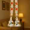 Man Hanging a Handcrafted Macrame Bell